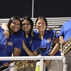 Woodwinds group hug and smile.